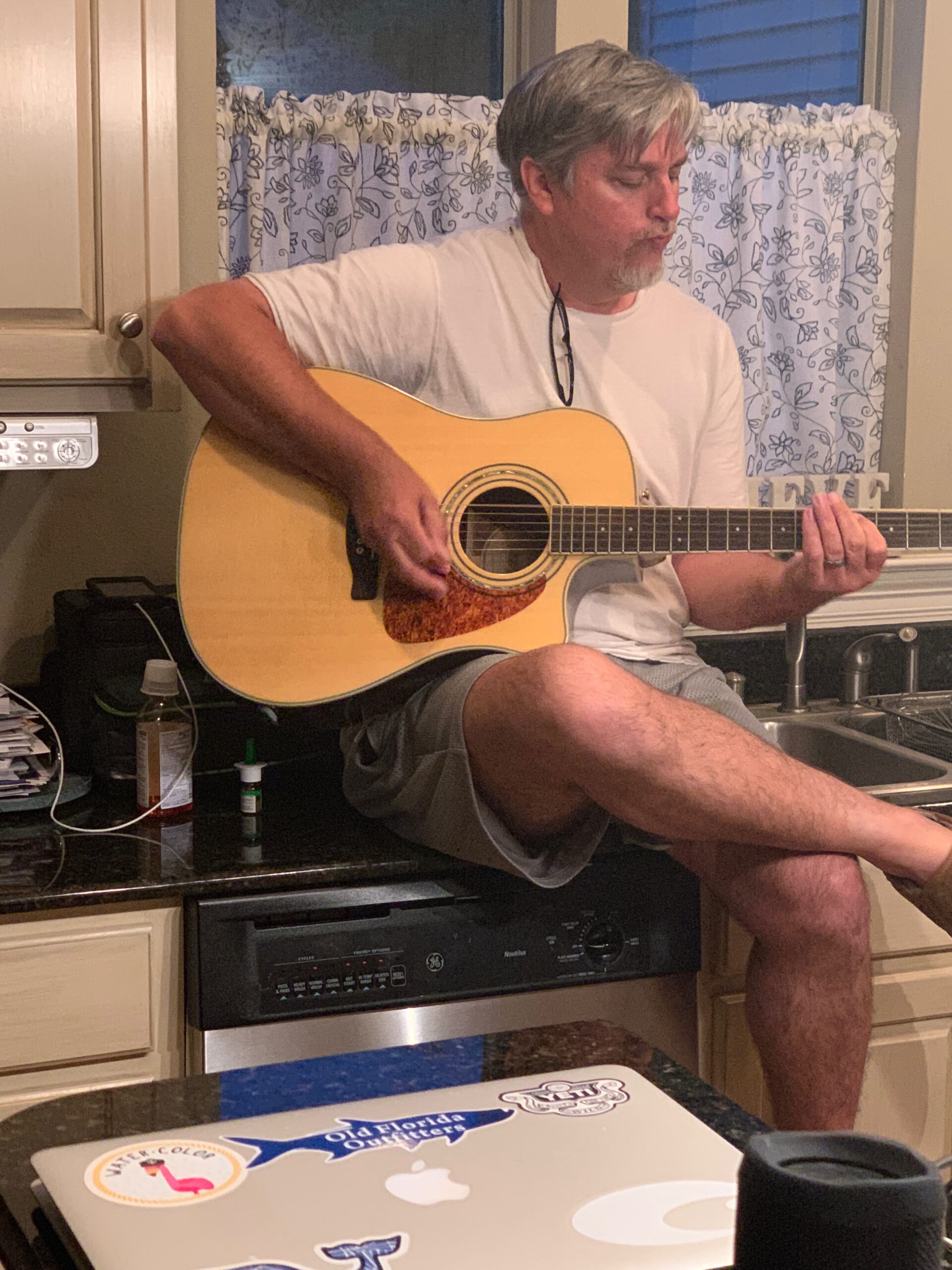 String Shock Steve playing an acoustic guitar
