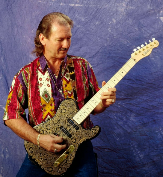 James Burton playing a telecaster electric guitar