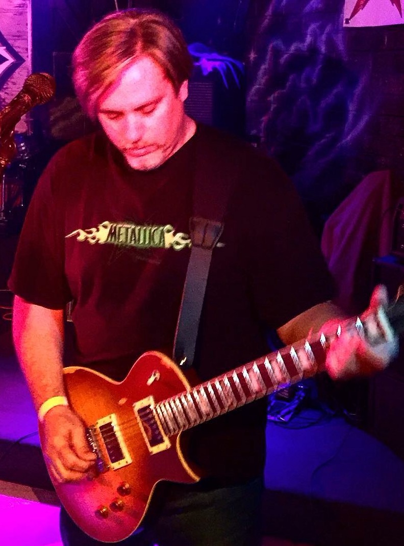 Guy playing an Ltd ec-256 electric guitar 